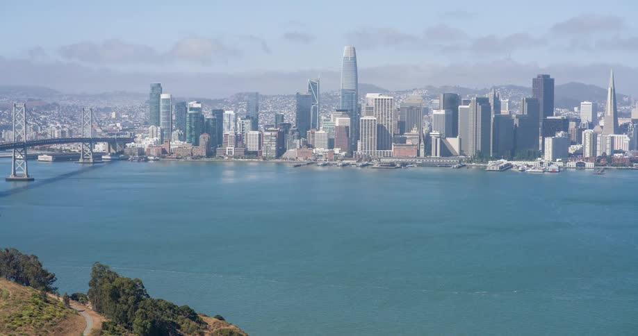 Light fog is on the city over the water