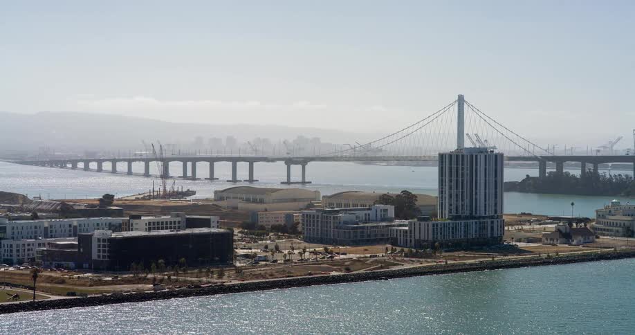 Urban seaside scene with a bridge in the background