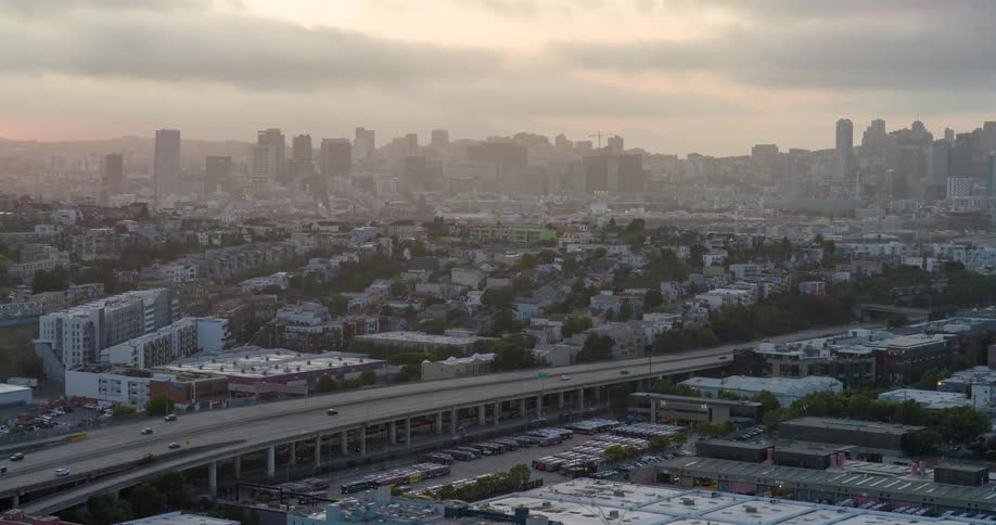 Aerial view of an urban area with skyscrapers in the background on a cloudy morning
