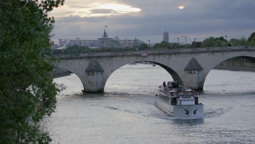 A ship moves under a bridge