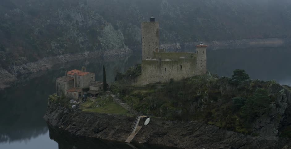 A stone building on a cliff
