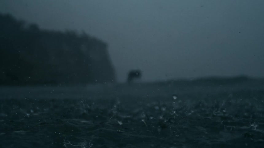 Storm rain falling into the ocean