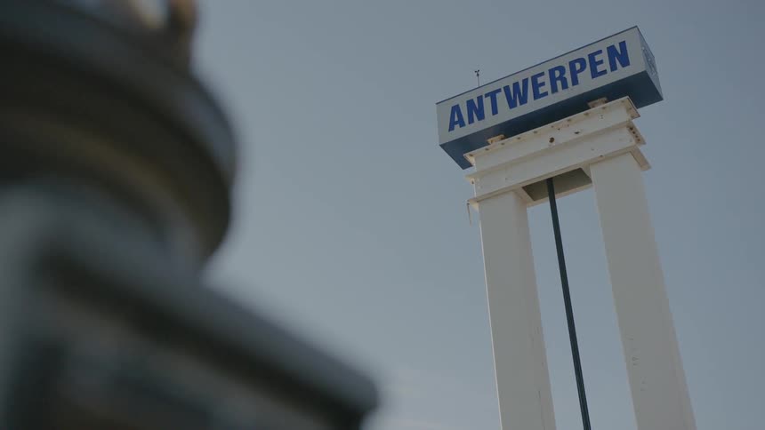 An antwerpen sign hangs in the air