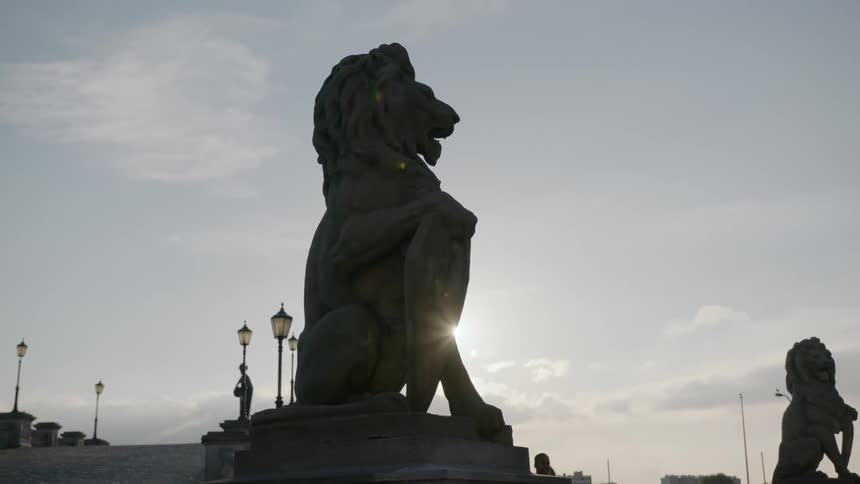 Sunlight shines down on lion statues