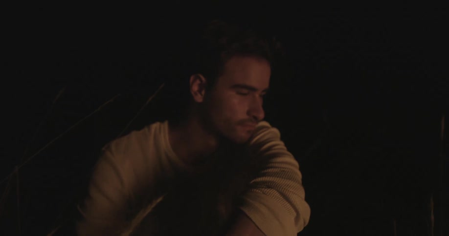 A person sitting by a campfire