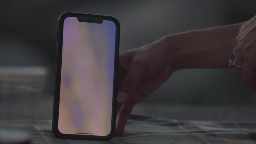 Closeup of a hand holding a smartphone