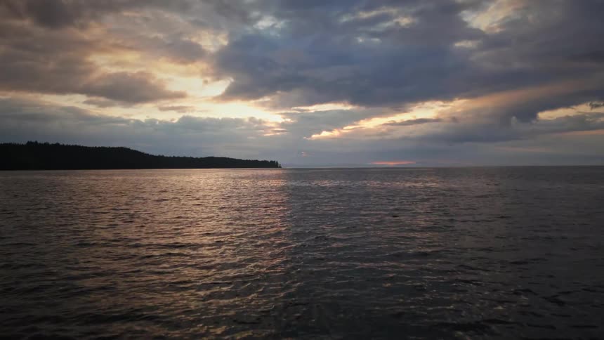 Heavy clouds are over the ocean and shore