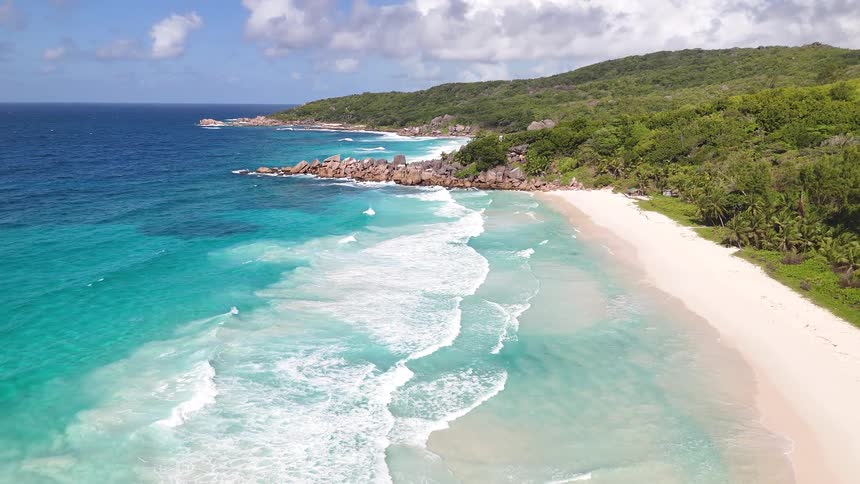 Aerial of tropical beach with pristine sandy beach and turquoise water