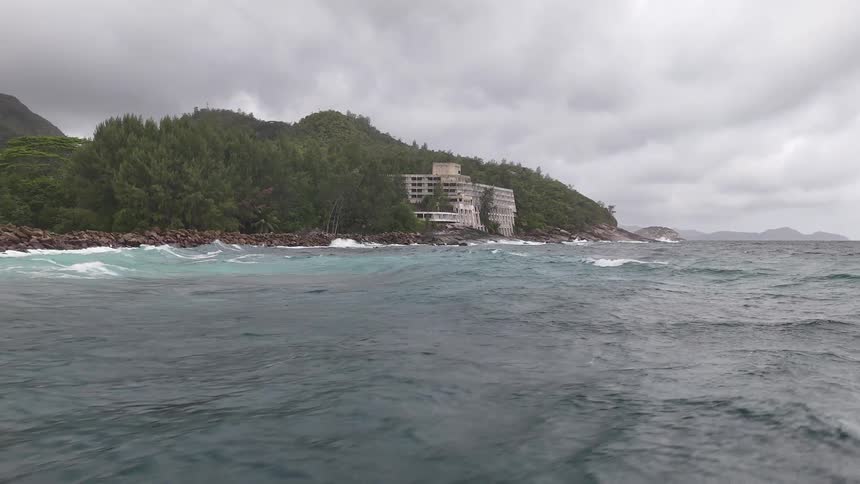 A single building is on the coast