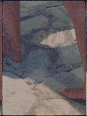 Legs of a woman walking on an outdoor terrace and barefoot