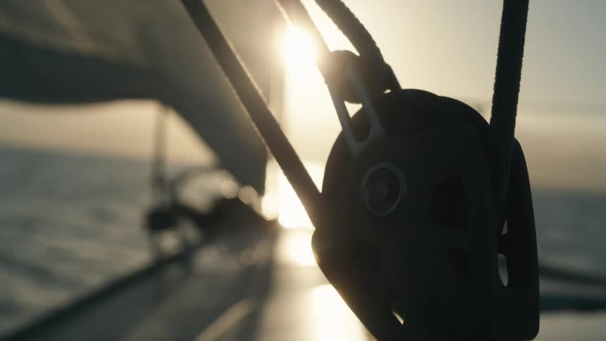 Closeup of a crank on a boat moving through the sea