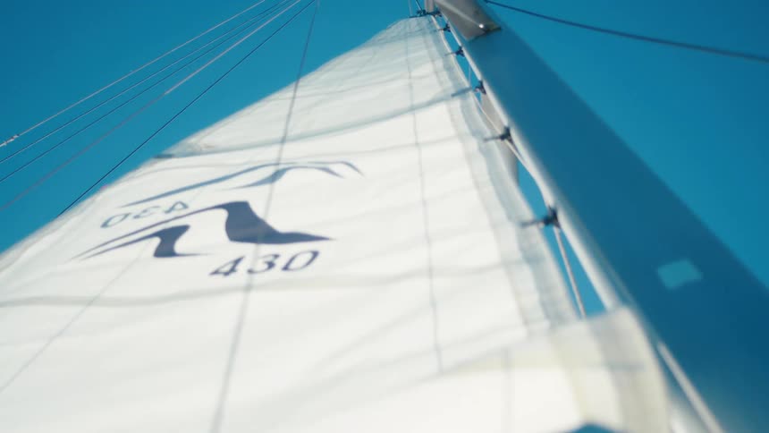 The sail is going up on the boat