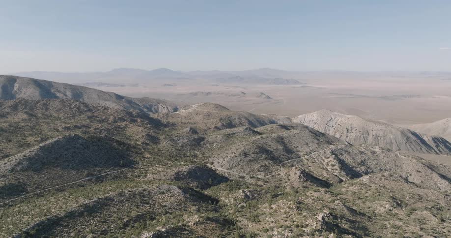 Aerial panorama of mountain ranges in a desert environment