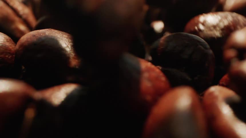 Coffee beans are falling into a stack