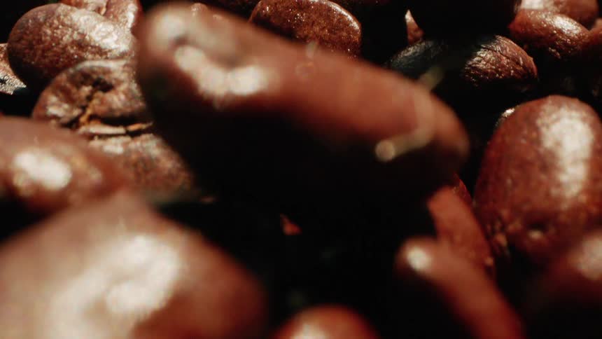 Coffee beans fall and land on eachother