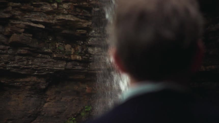 Person watching the waterfall
