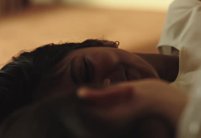 Two girls lying down playing