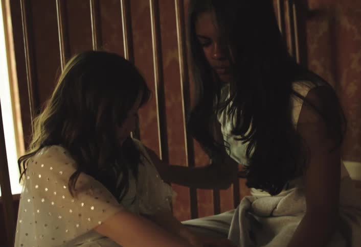 Two friends sit together while one is being consoled
