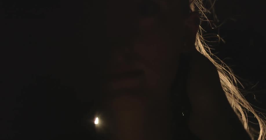 A man runs his hand through a woman's hair