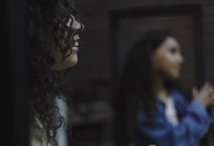 Two girls in an indoor space with happy expression