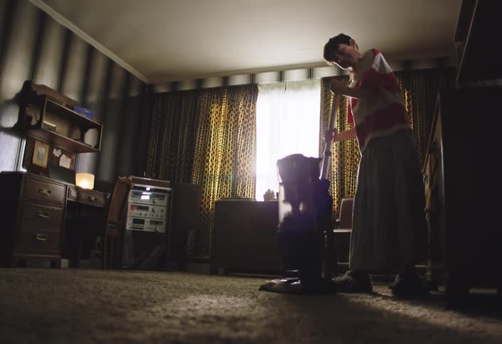 The child unclogs the vacuum and checks the hose