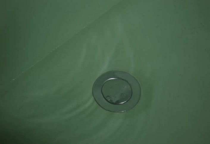 Water dripping into a bathtub