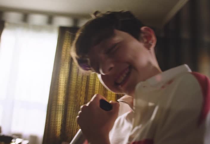 Child playing with a vacuum cleaner