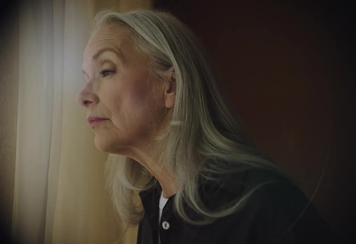 Woman looking out of a window