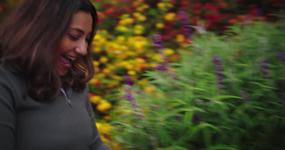 Mother pushes her daughter in a stroller