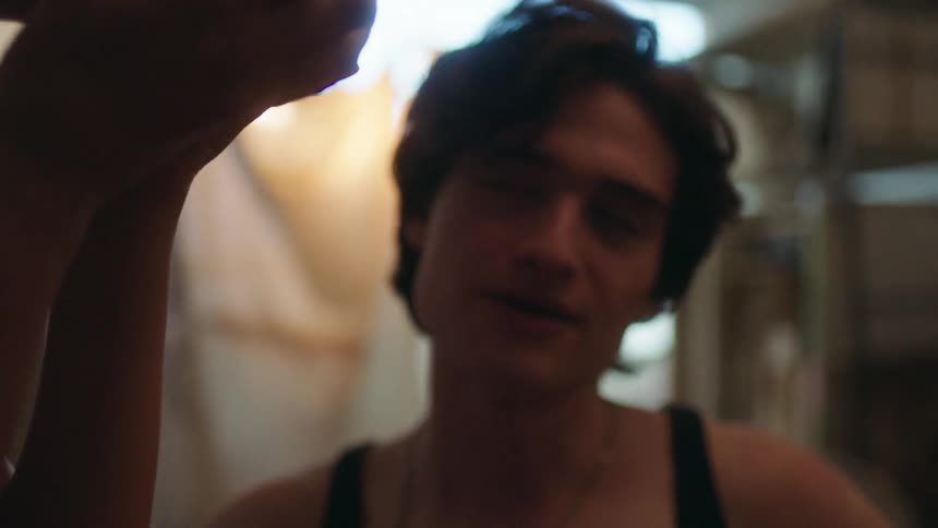 A man speaks to another person