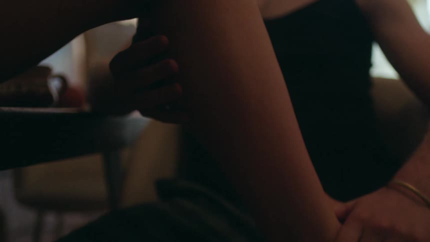 A man massages a womans foot
