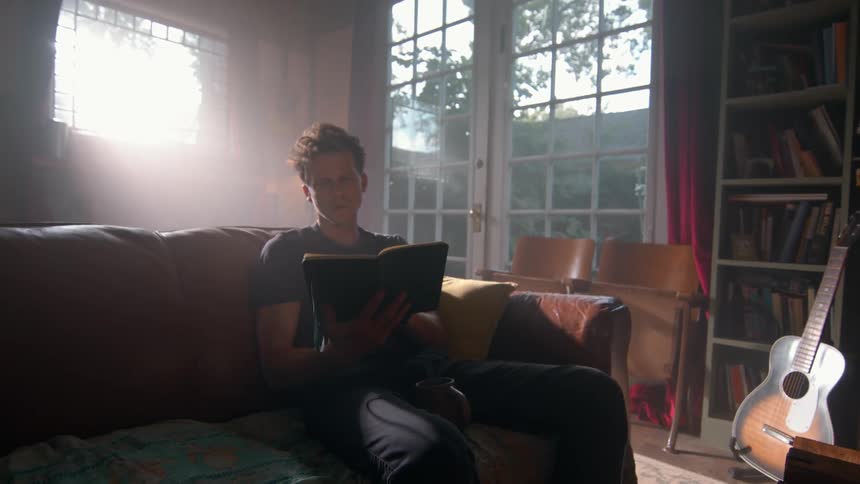 Man sitting reading a book