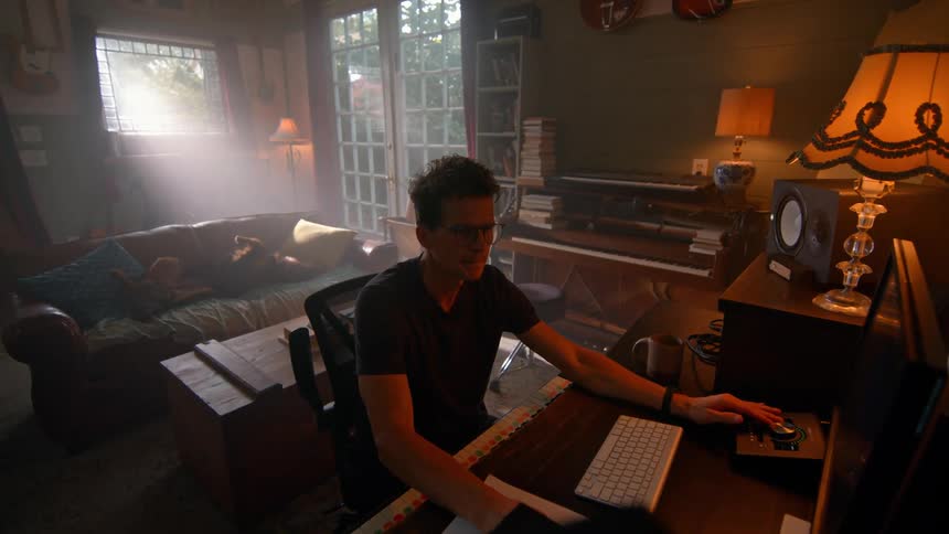 Man sitting and interacting with a computer