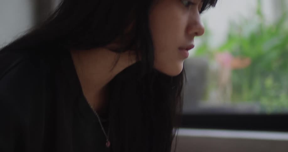 The girl is using the trackpad on the laptop
