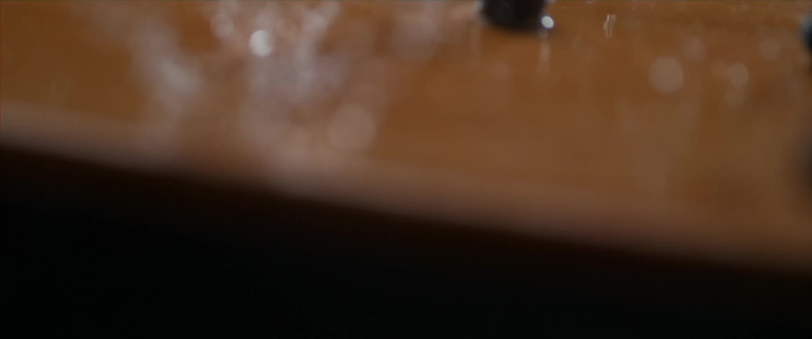 Blueberries and water fall to a cutting board
