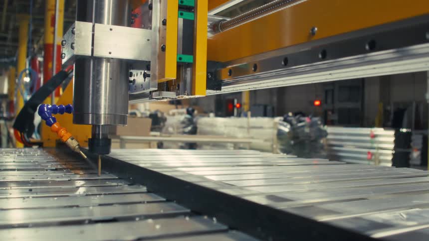 The machine is drilling in the factory