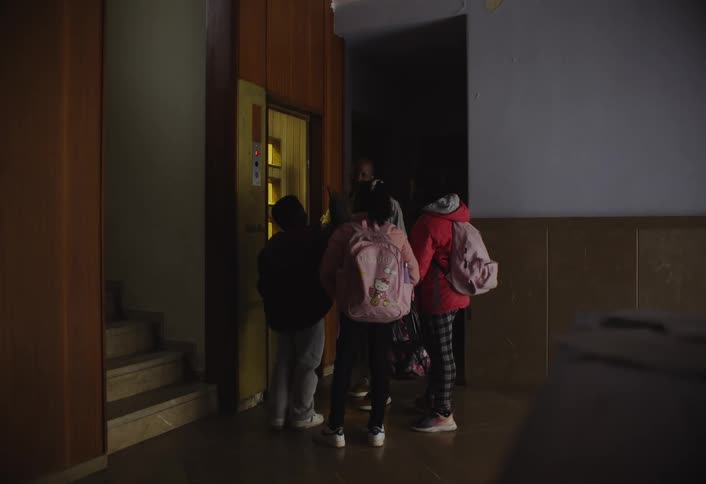 Small group of people entering an elevator