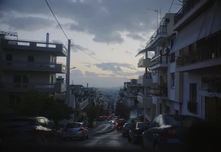 The road is full of parked cars