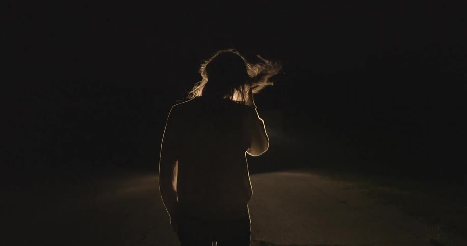 A person's hair blowing in the wind