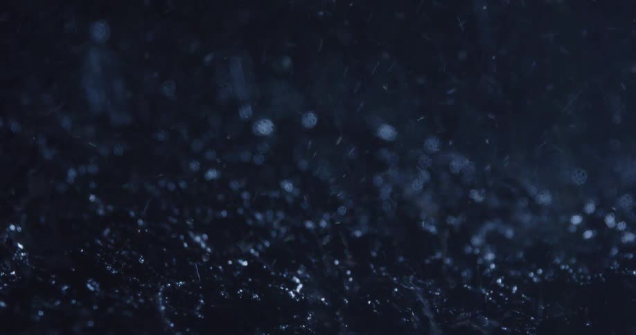 Rain at night falling on the mud