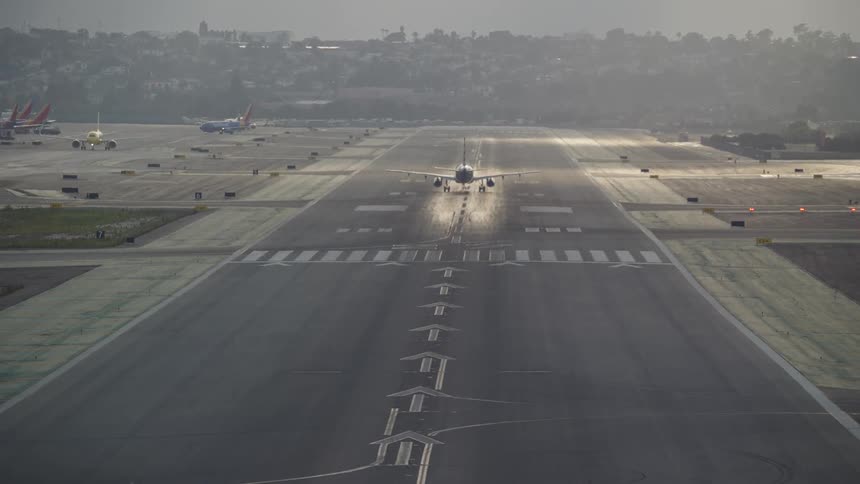 Airplane taking off from runway at an airport