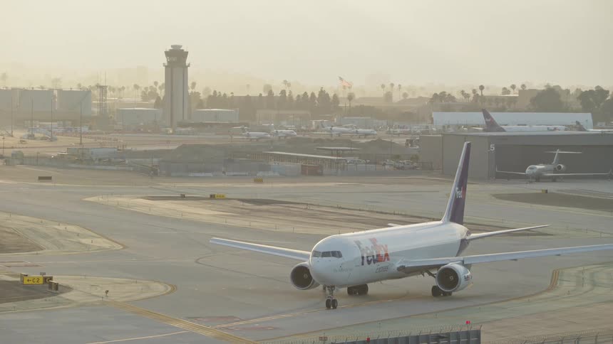 Logistics and commercial aircraft at an airport