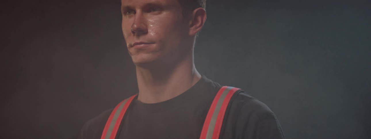 Man with sweaty face using seat belt indoors
