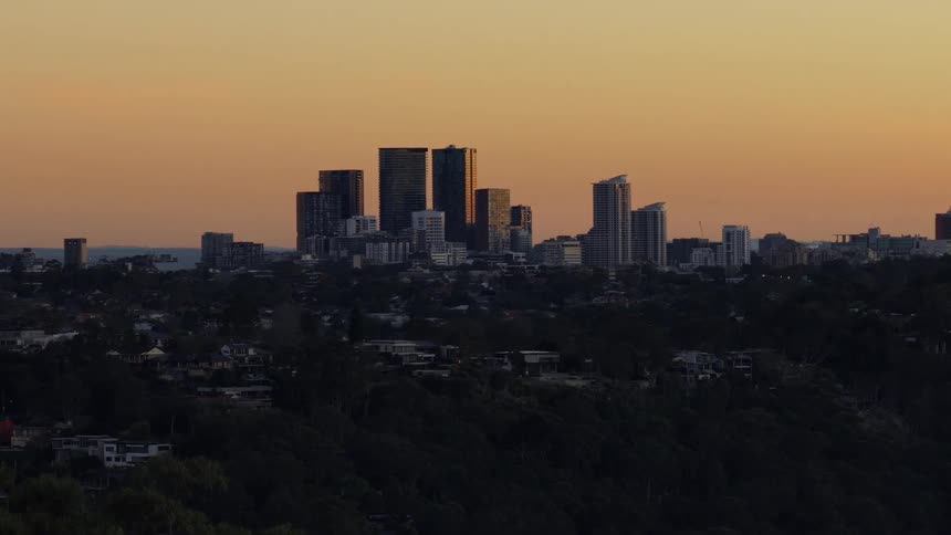The sun is rising on the big city