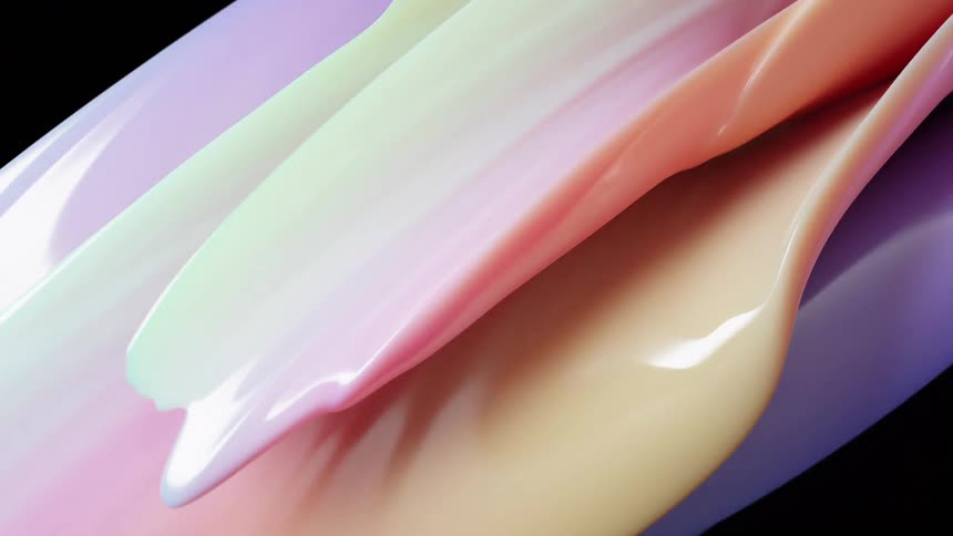 Closeup of smooth glossy abstract forms layered over one another in flowing wavelike shapes