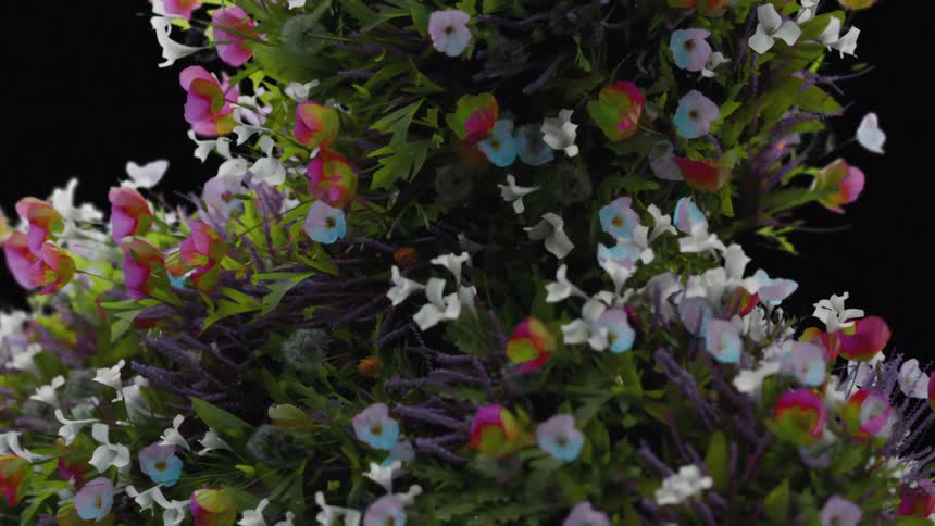 A dense bunch of colorful artificial flowers against a black background