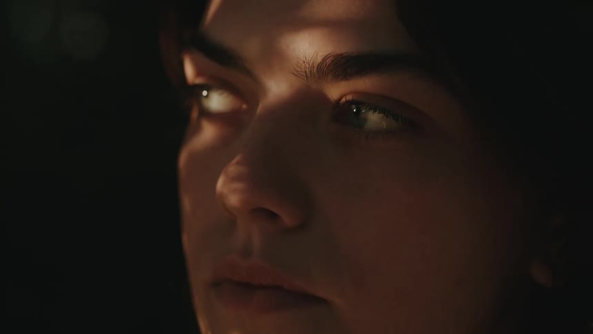 Closeup portrait of a womans face focusing primarily on her eyes and the upper part of her face