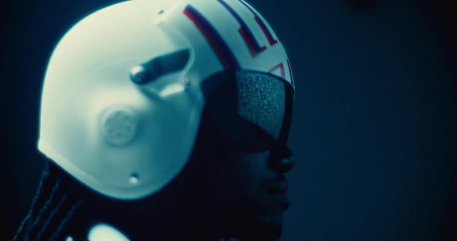 Man with a white helmet and reflection in glasses