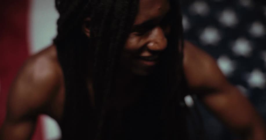 Dreadlocked man without a shirt