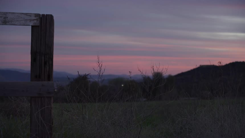 A large area of grassland at sundown